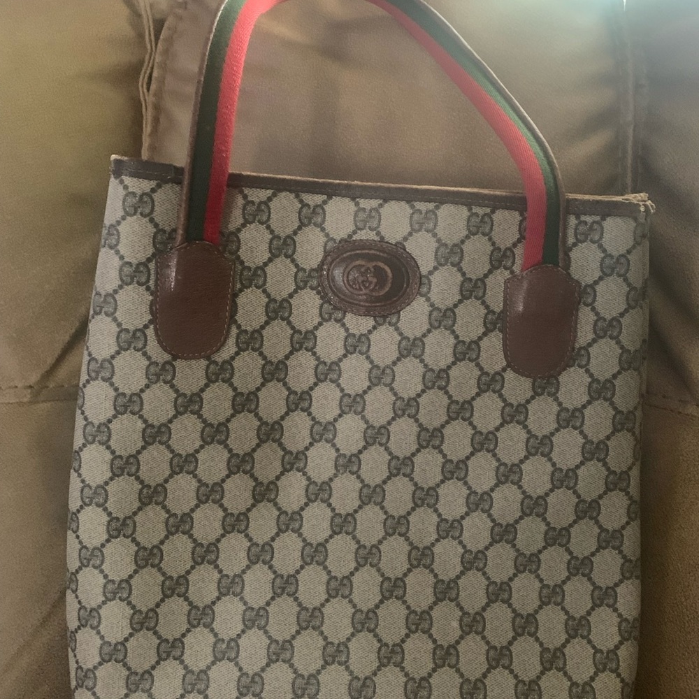 Reposhing the Gucci tote, added is the boat Gucci bag, some life left in both.